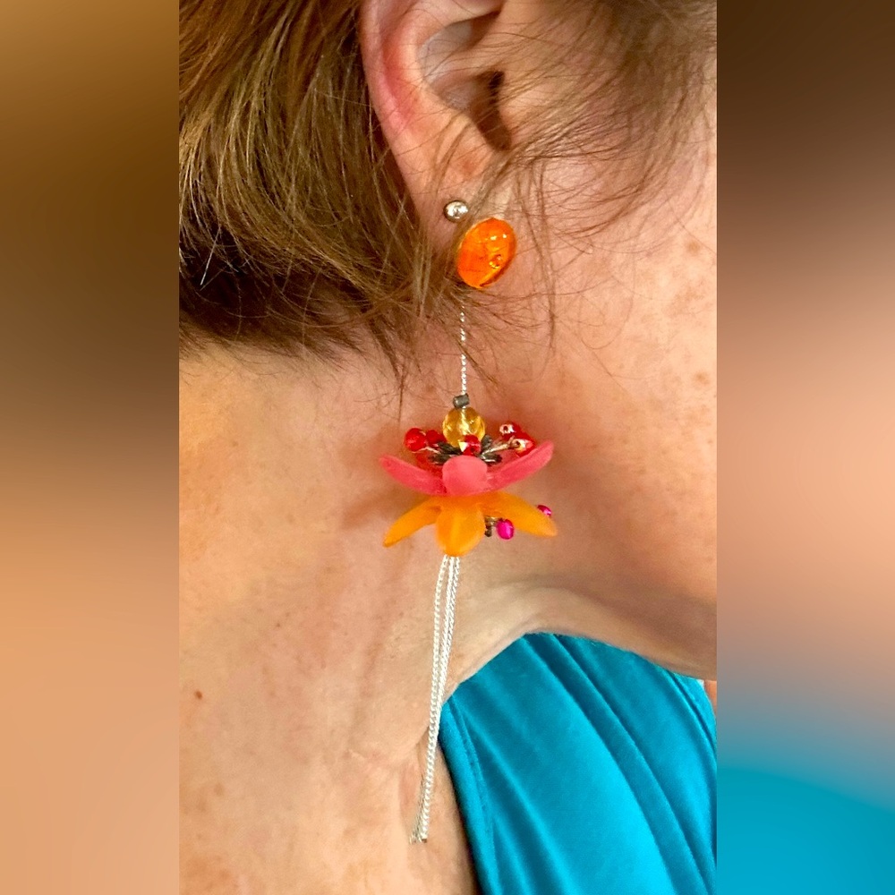 Whimsical, flower earrings from Lalo in pink and orange.